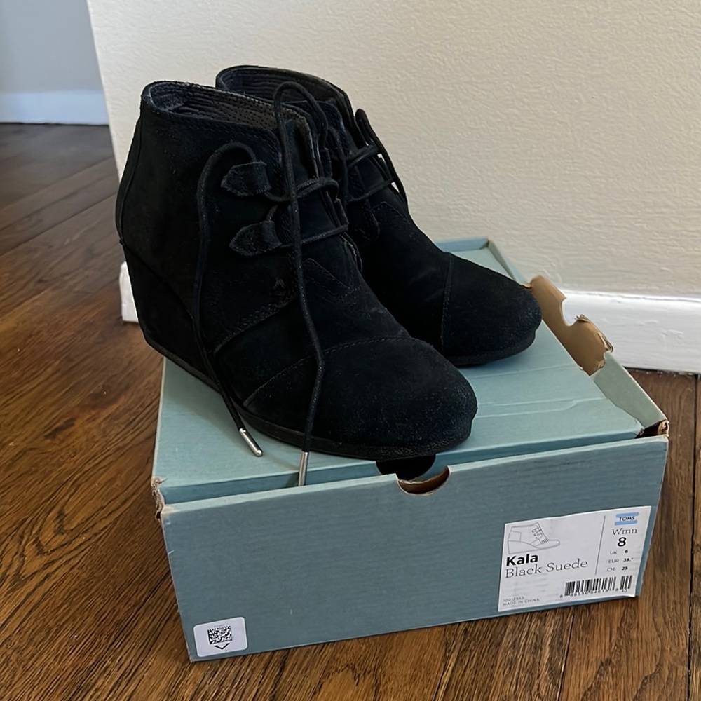 Black suede wedge shoes. TOMS